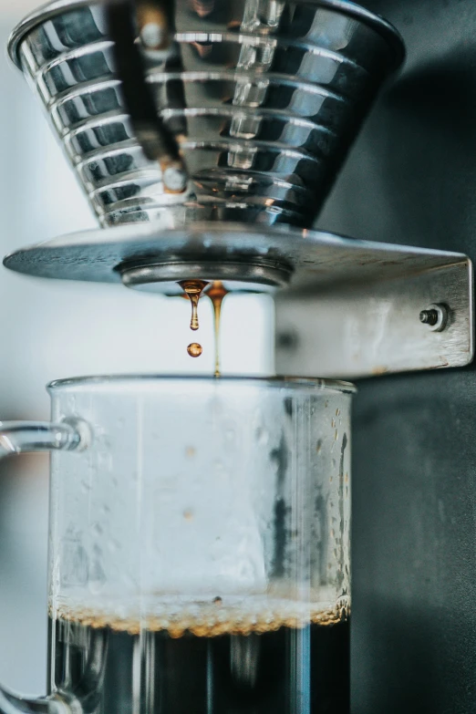 the view of a espresso machine pouring coffee