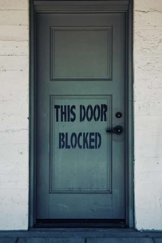 a door that has been decorated with black spray paint