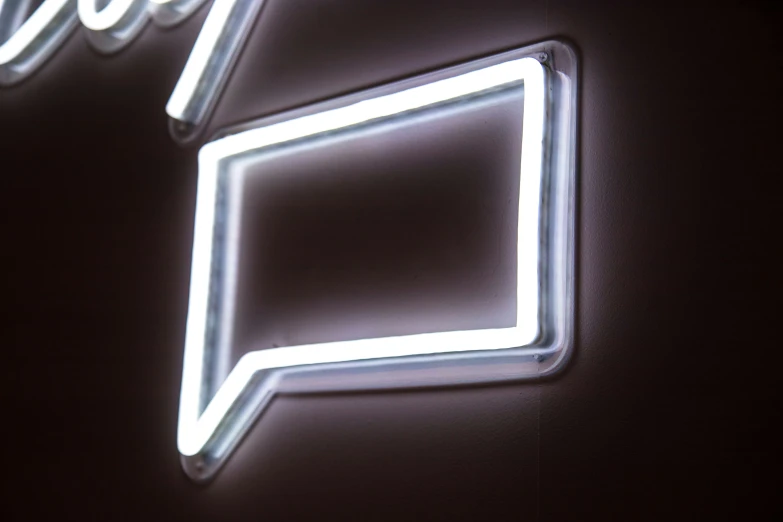 a neon sign with a word shaped like a box