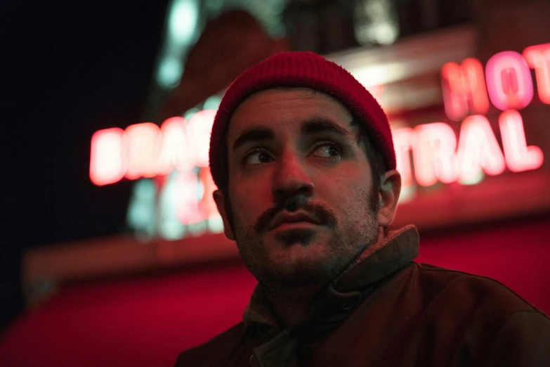 a man wearing a red hat and scarf