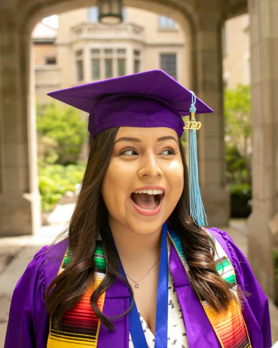 the graduate is wearing a cap and gown