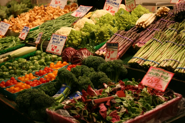 an assortment of fruits and vegetables for sale