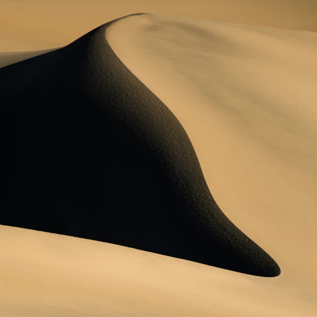 an arid area with several large dunes