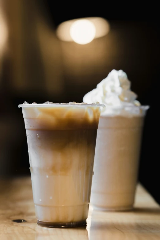 a cup of coffee with whipped cream on top