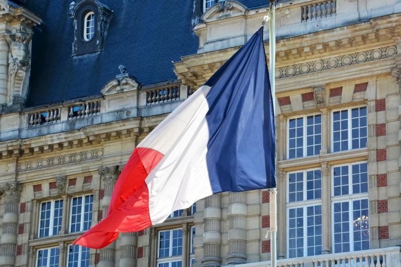 two flags with one big and the other small on top of it