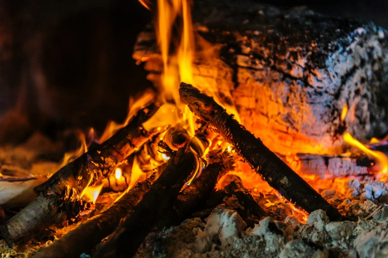 a stove top with fire burning inside of it