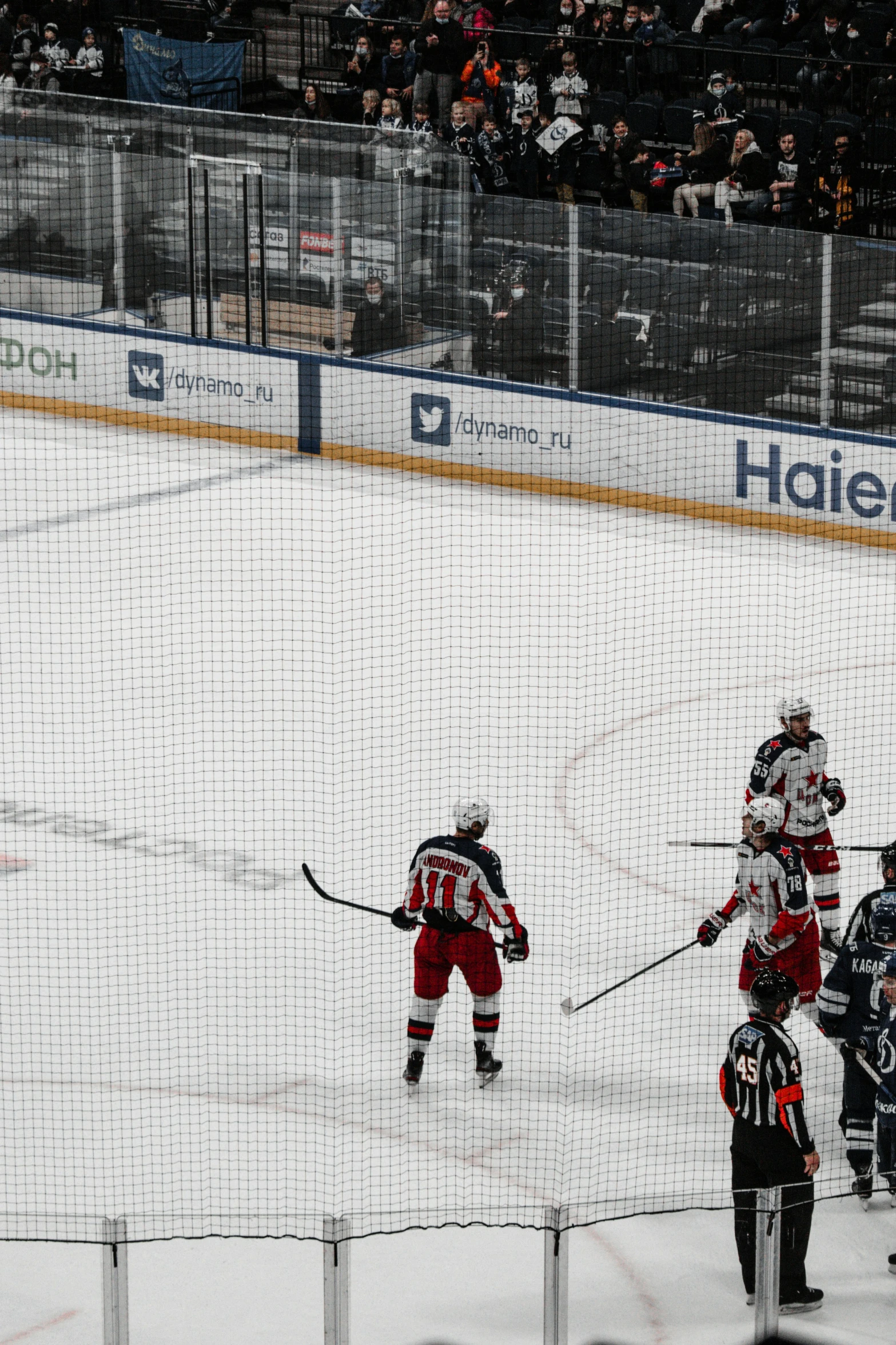 a hockey player walks across the ice