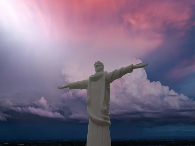 there is a large statue of christ and it is in the air