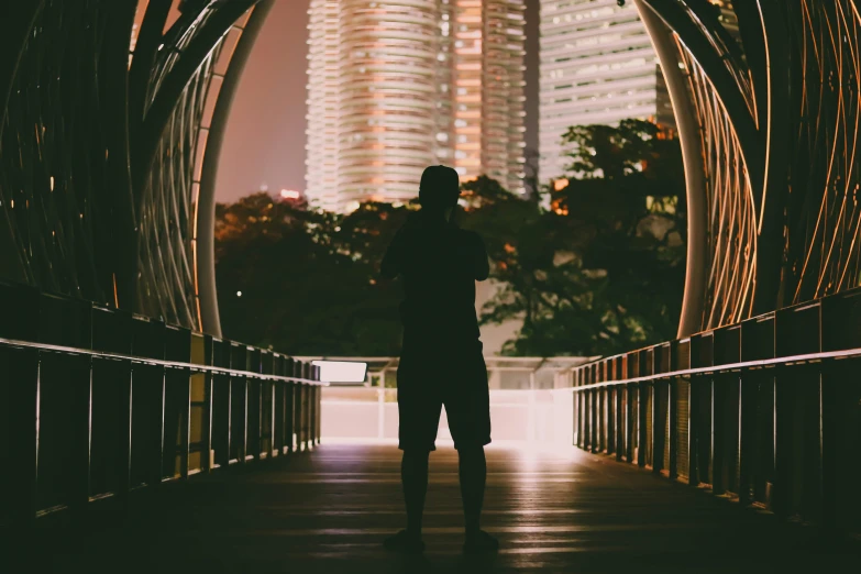 a man is standing in the tunnel in the city