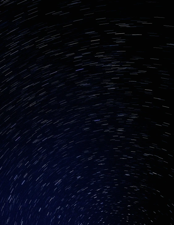 stars streak in the sky at night