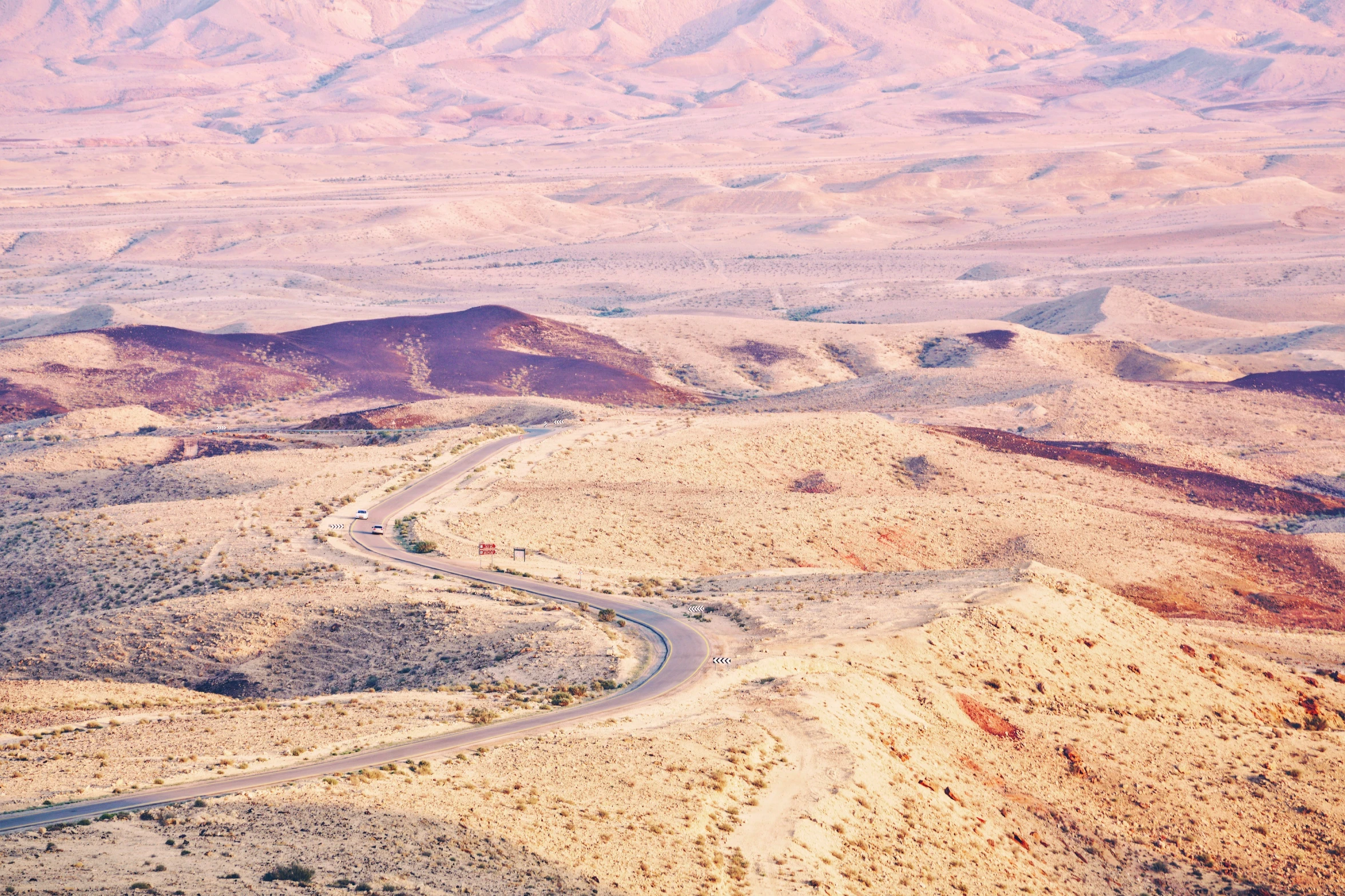 a view of a mountain top in the middle of the desert