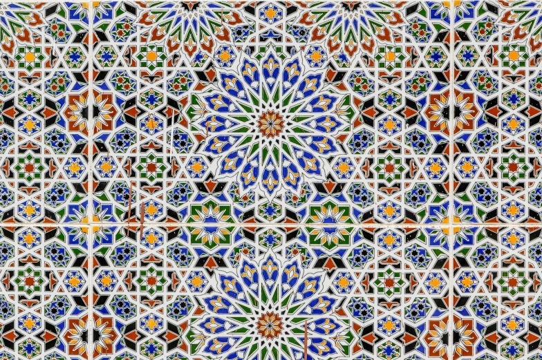 an intricate mosaic tile design with multi - colored and gold geometrics