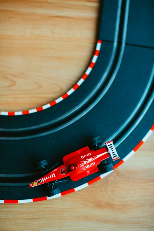 the small race car is driving on the track