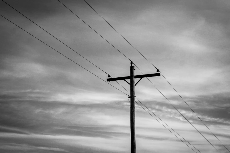 an old telephone pole and power line with no wires