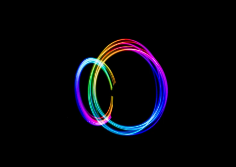 a pair of colored loops against a black background