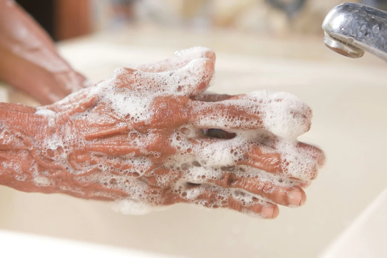 hands wash their fingers with soap on them