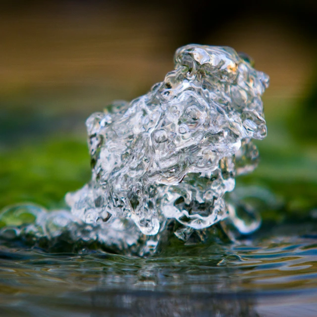 the view from the ground of a small crystal structure in water