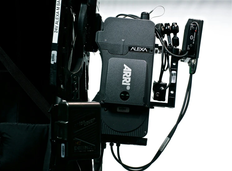 a camera attached to a wall with cords
