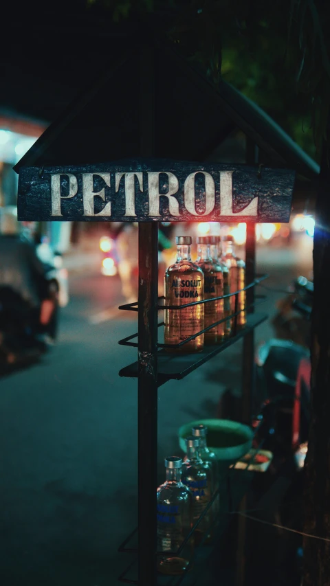 bottles are on display outside in the dark