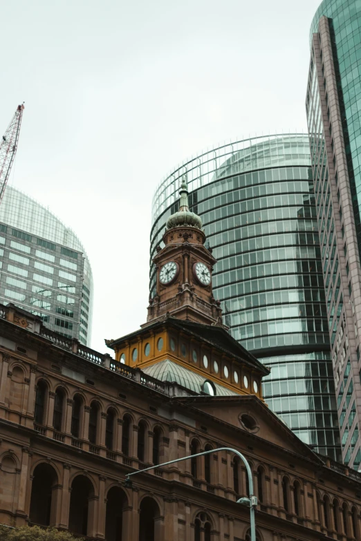 an architectural building with two big buildings in the background