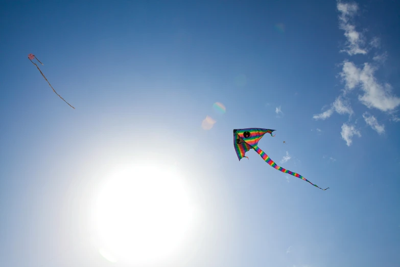 a kite in the sky is flying high into the air