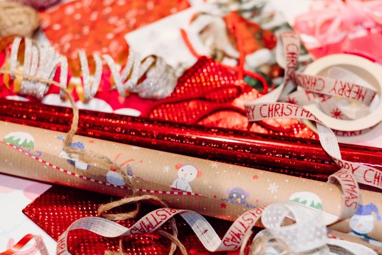 wrapping paper, christmas themed bows and tags