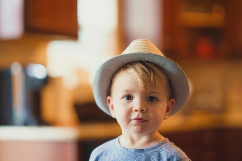 a  is wearing a hat in the living room