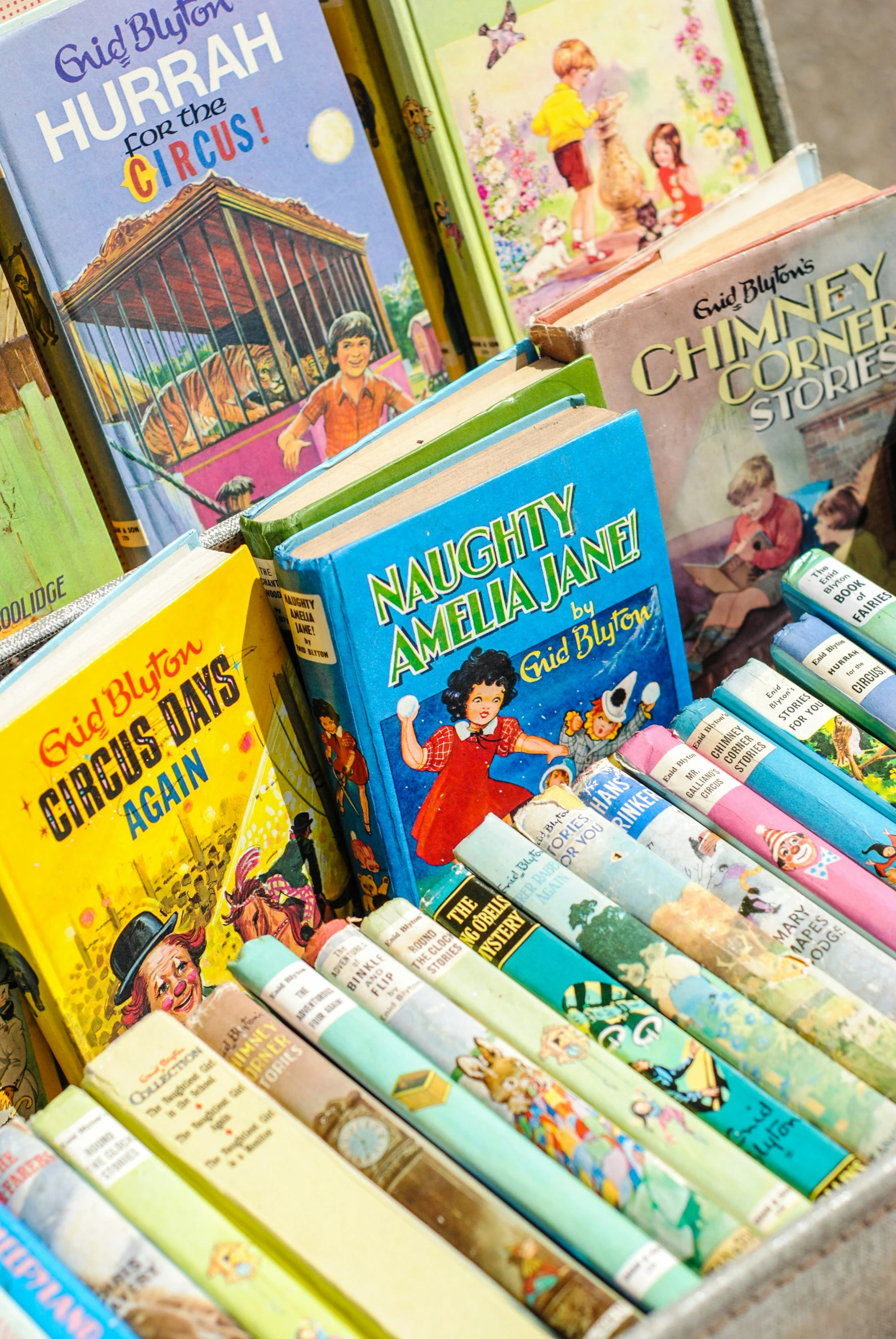 a stack of children's books sitting in a crate