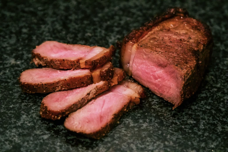 a close up of a bunch of meat with some kind of brown crust