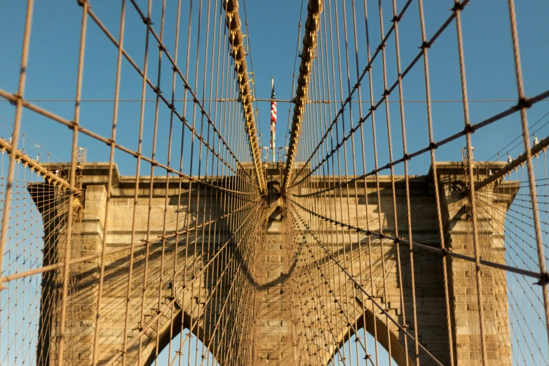 the view through a chain link fence at the top of a bridge