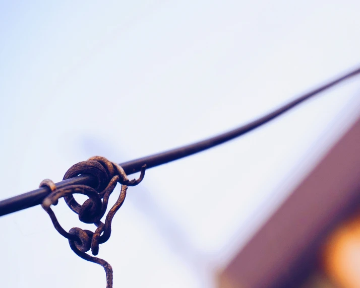 closeup view of a rusty wire in the air