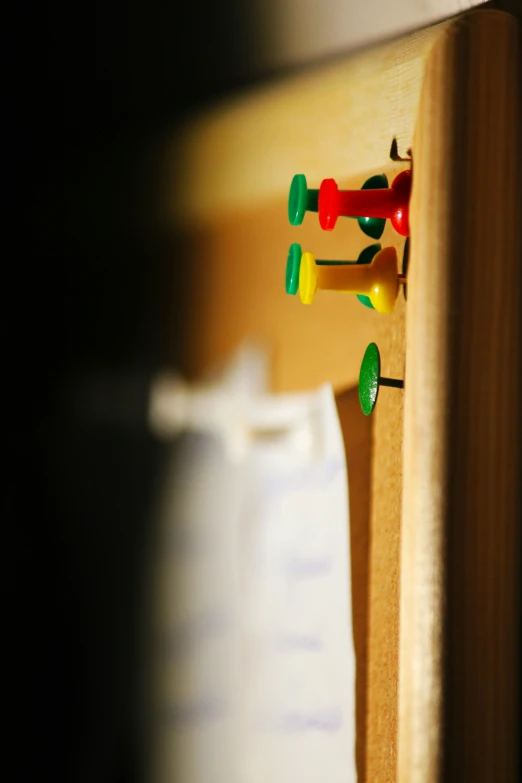some little toy figures in front of a wooden door