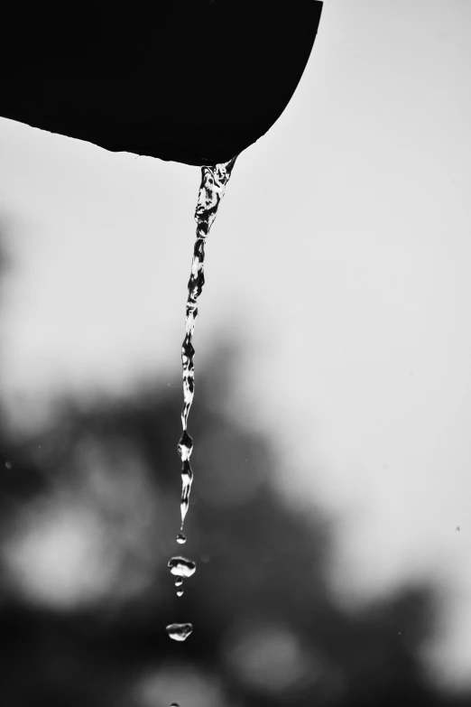 water dripping from faucet from outside the faucet