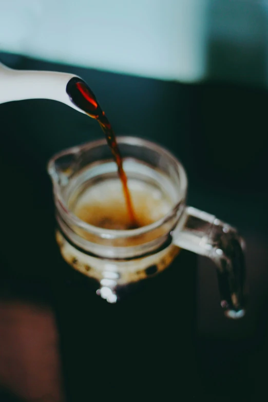 a coffee drink being filled with liquid