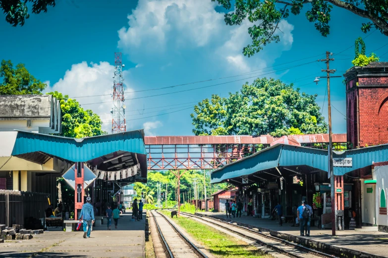 the people are waiting for a train to arrive