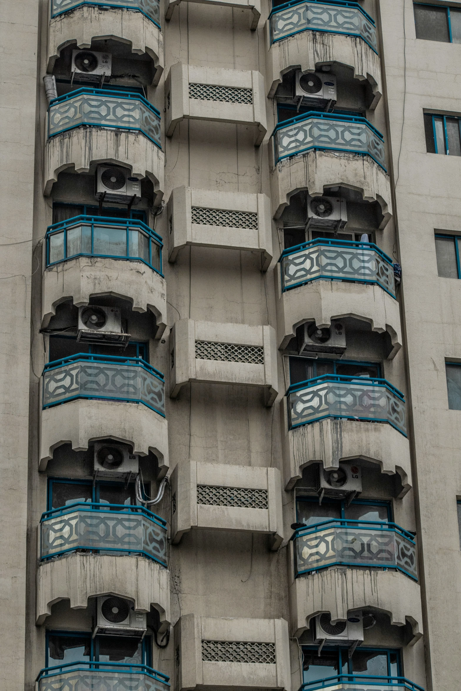 an apartment building with windows on the second floor