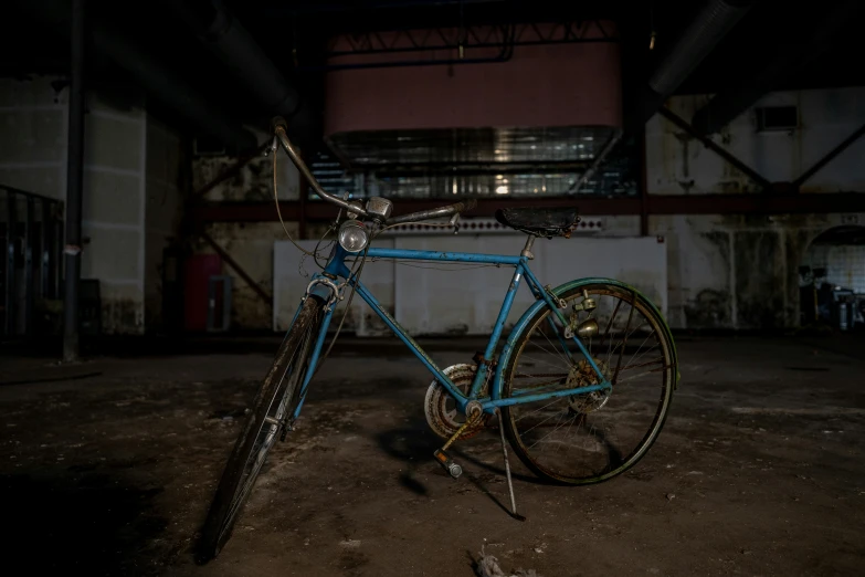 a bike leaning up against a wall with graffiti on it