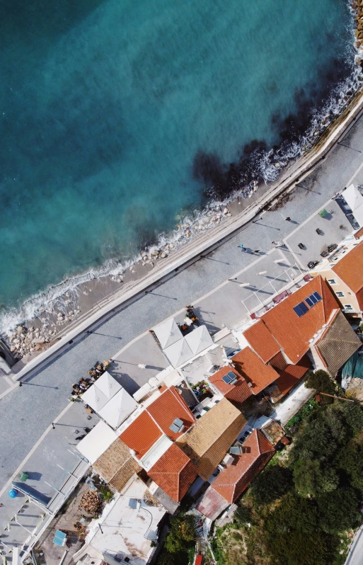 aerial view of beach houses next to ocean