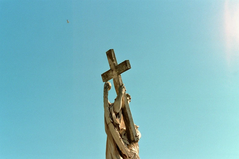 there is a statue of jesus carrying the cross