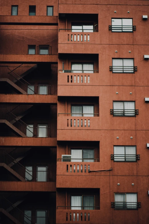 the facade of an apartment building with stairs