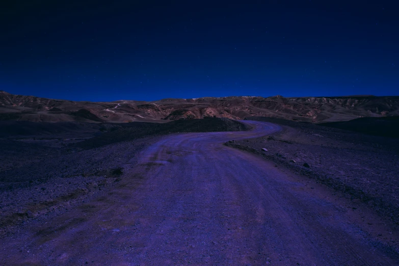 a view of a road in the middle of nowhere at night