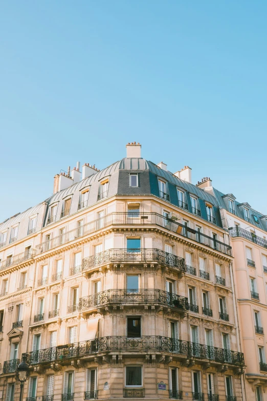 a building with many windows and balconies is pographed from outside