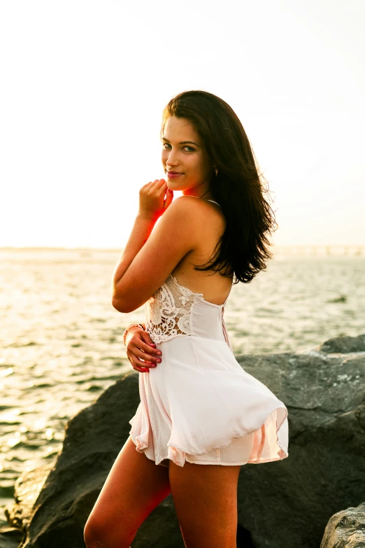 a women who is posing on the rocks