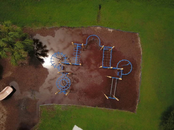 the top view of a playground with an upside down play area