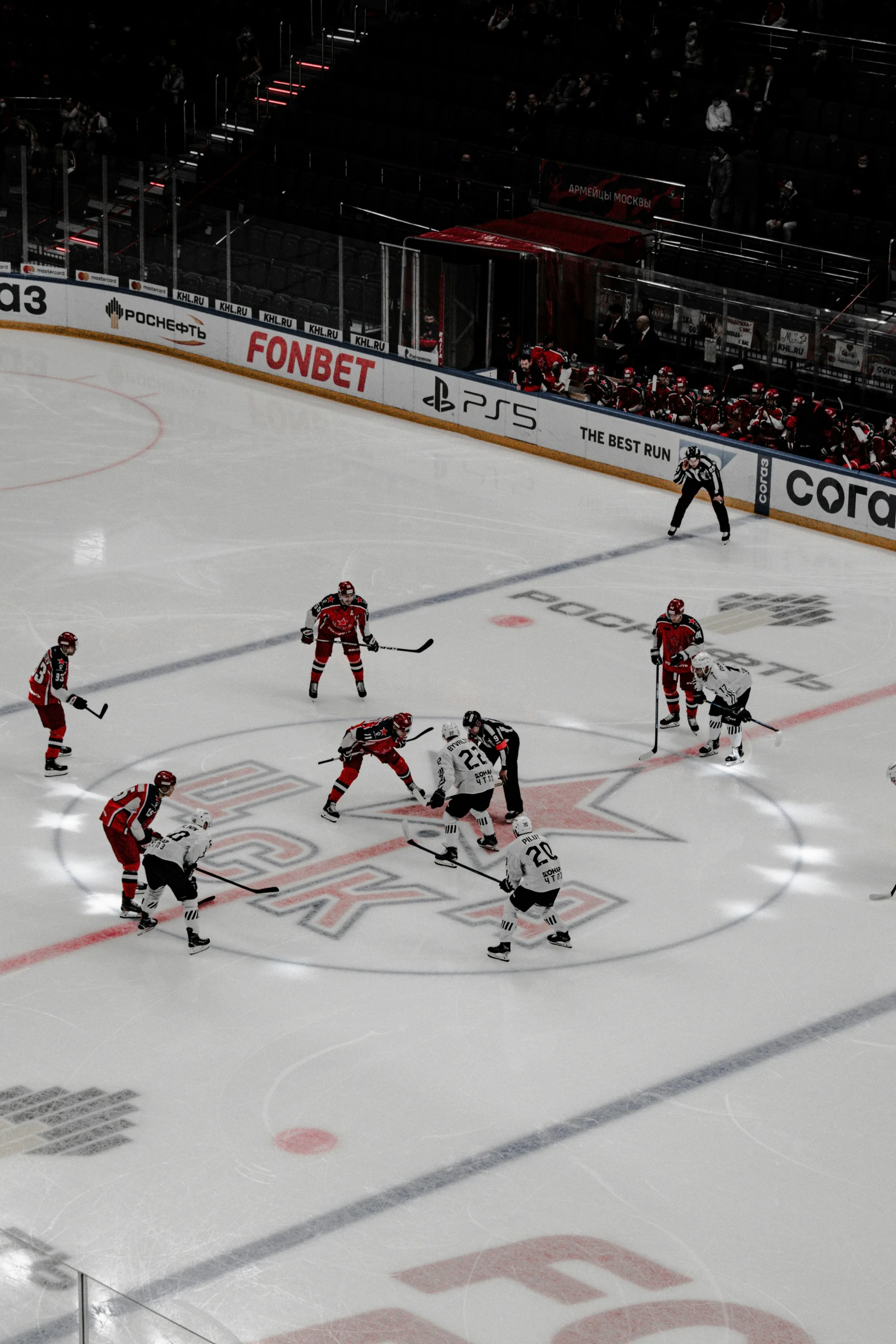 a group of players are playing ice hockey