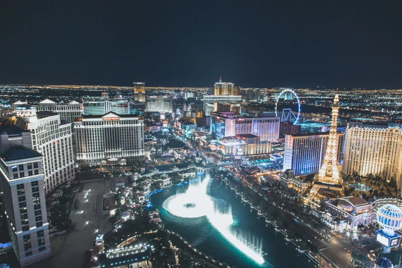 the las vegas city skyline is lit up at night