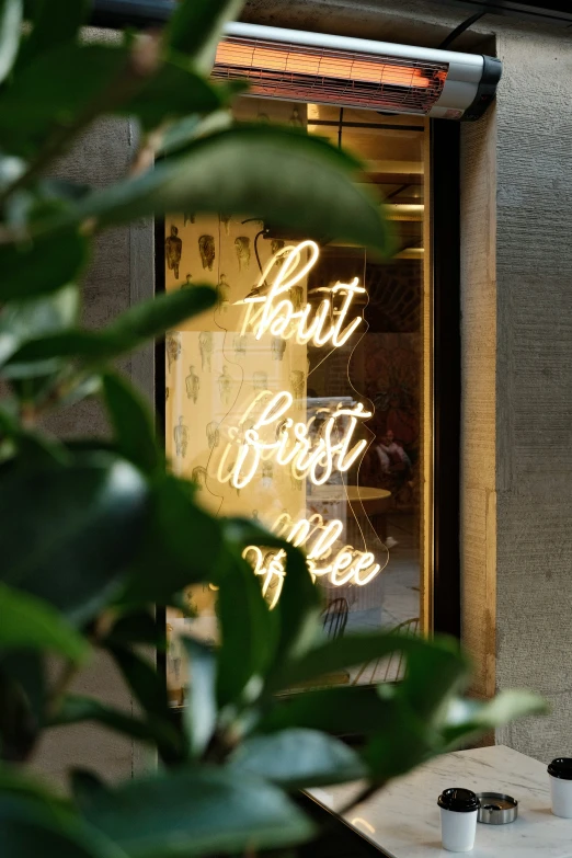 bright neon sign displayed outside an upscale restaurant