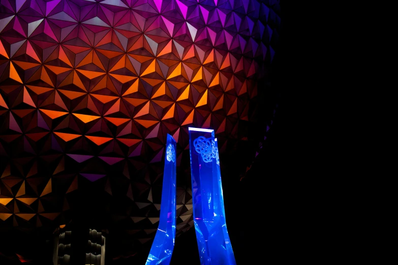 the top part of a large ball with blue ribbon around it