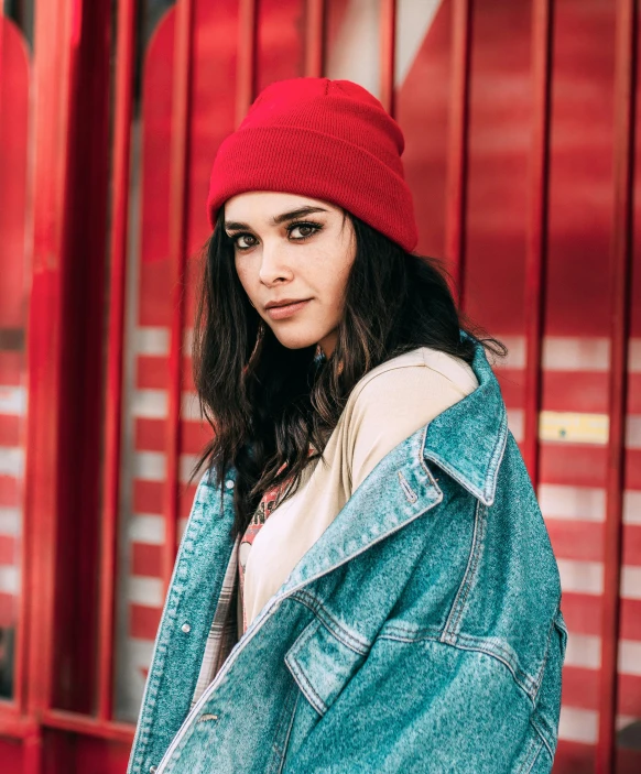 a girl in a red hat is outside