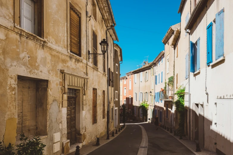 narrow streets and cobblestone paved with potted plants